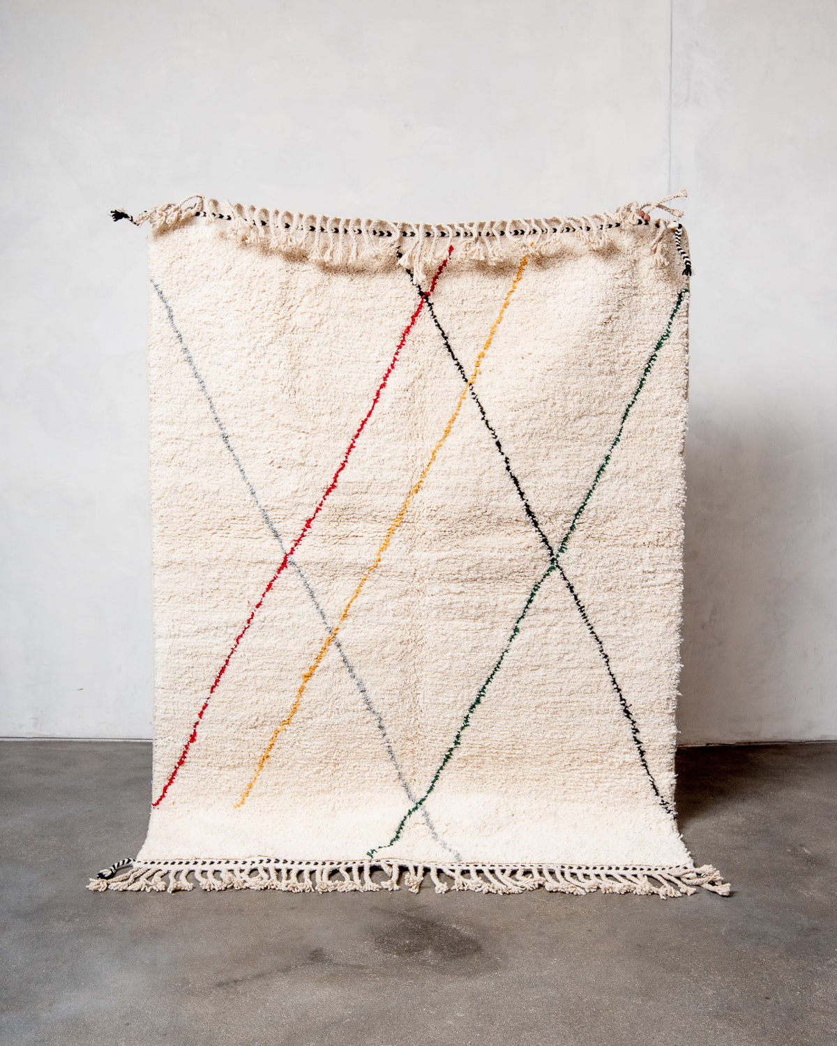 Modern, designer, handcrafted Berber rug from Morocco. Beniourain carpet with beautiful colours and patterns and fluffy wool texture.